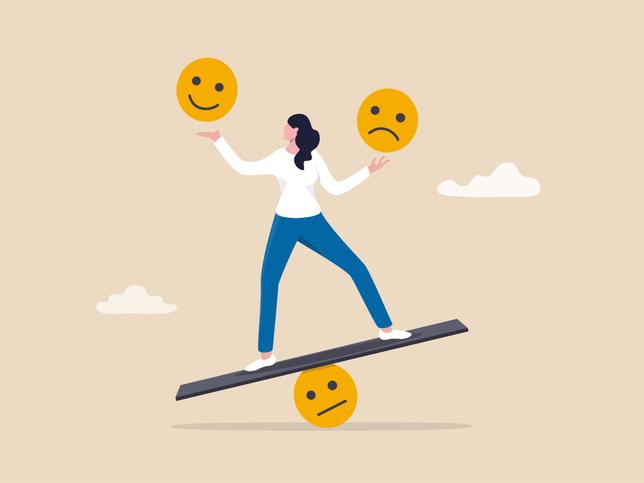 Cartoon of a person balancing on a seesaw juggling different emotions.