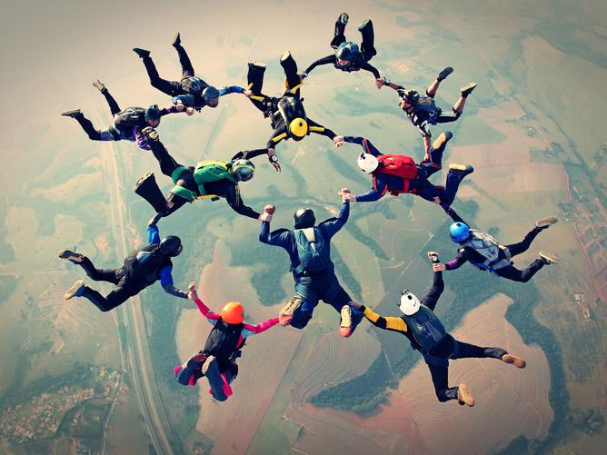 A group of people skydiving.