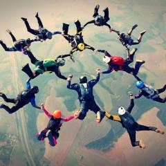 A group of people skydiving.